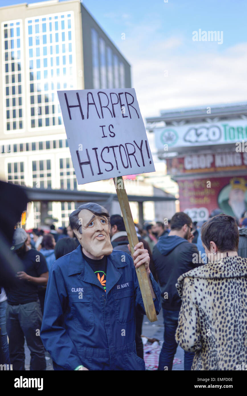Toronto, Canada. 20th Apr, 2015. A Mask man holding sign saying 'Harper is history' on 420 rally day in Toronto. Credit:  NISARGMEDIA/Alamy Live News Stock Photo