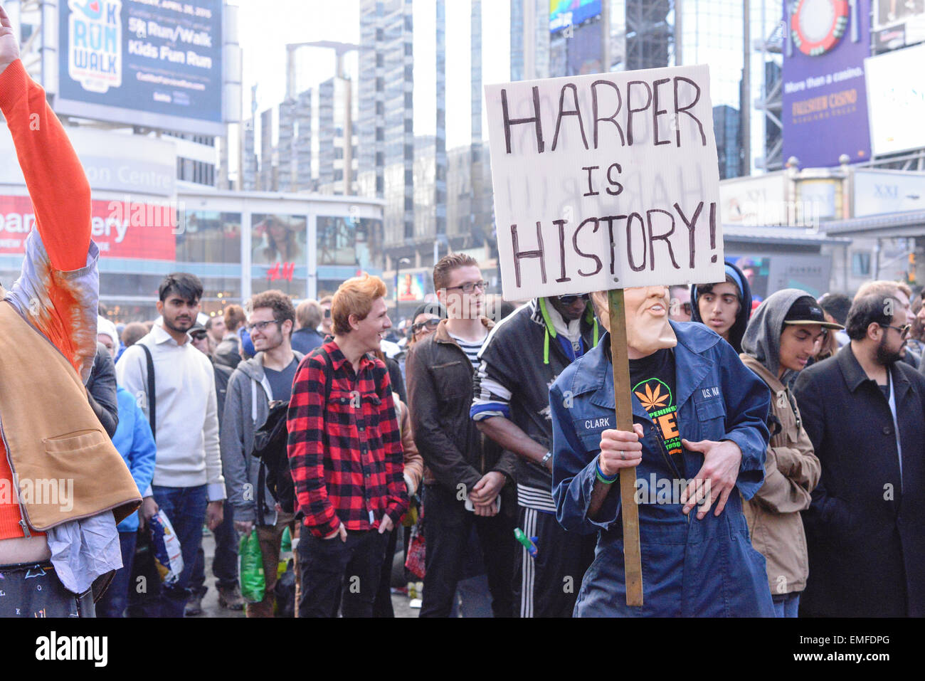 Toronto, Canada. 20th Apr, 2015. A Mask man holding sign saying 'Harper is history' on 420 rally day in Toronto. Credit:  NISARGMEDIA/Alamy Live News Stock Photo