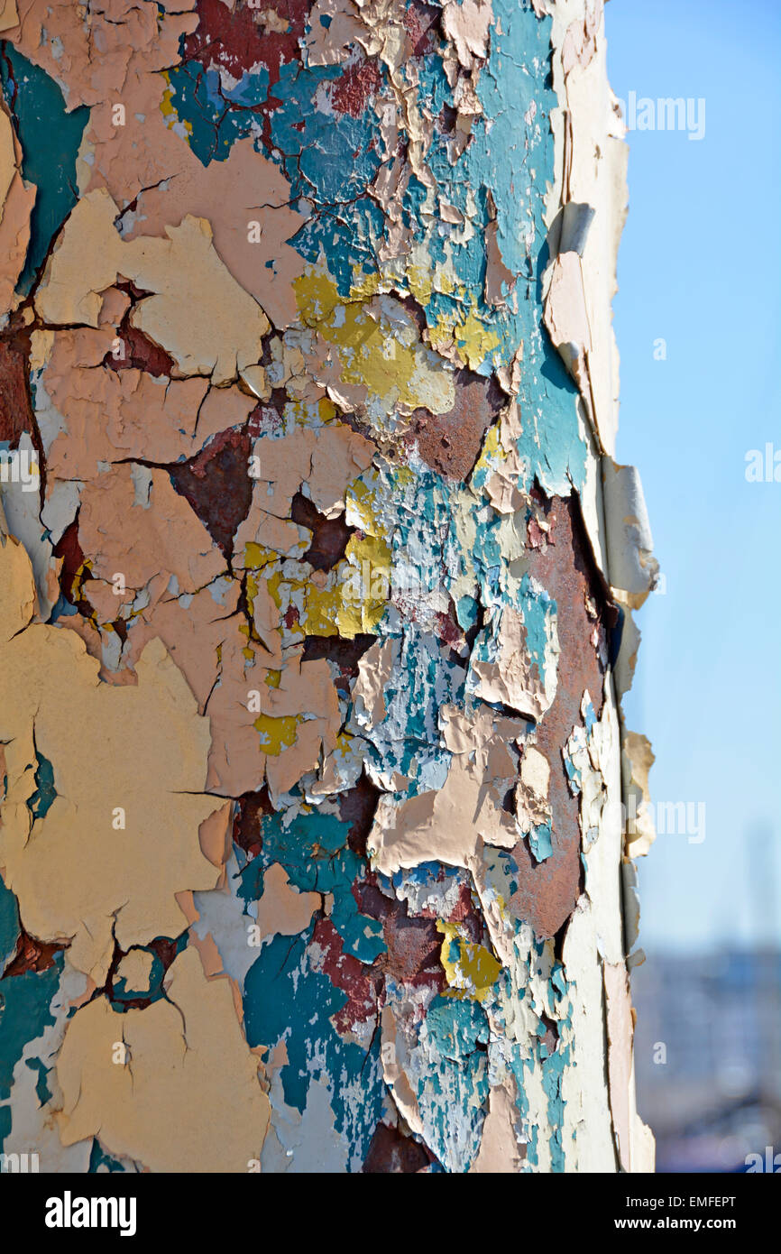 Multiple layers of flaking paint on rusting steel column Ipswich Suffolk England UK Stock Photo