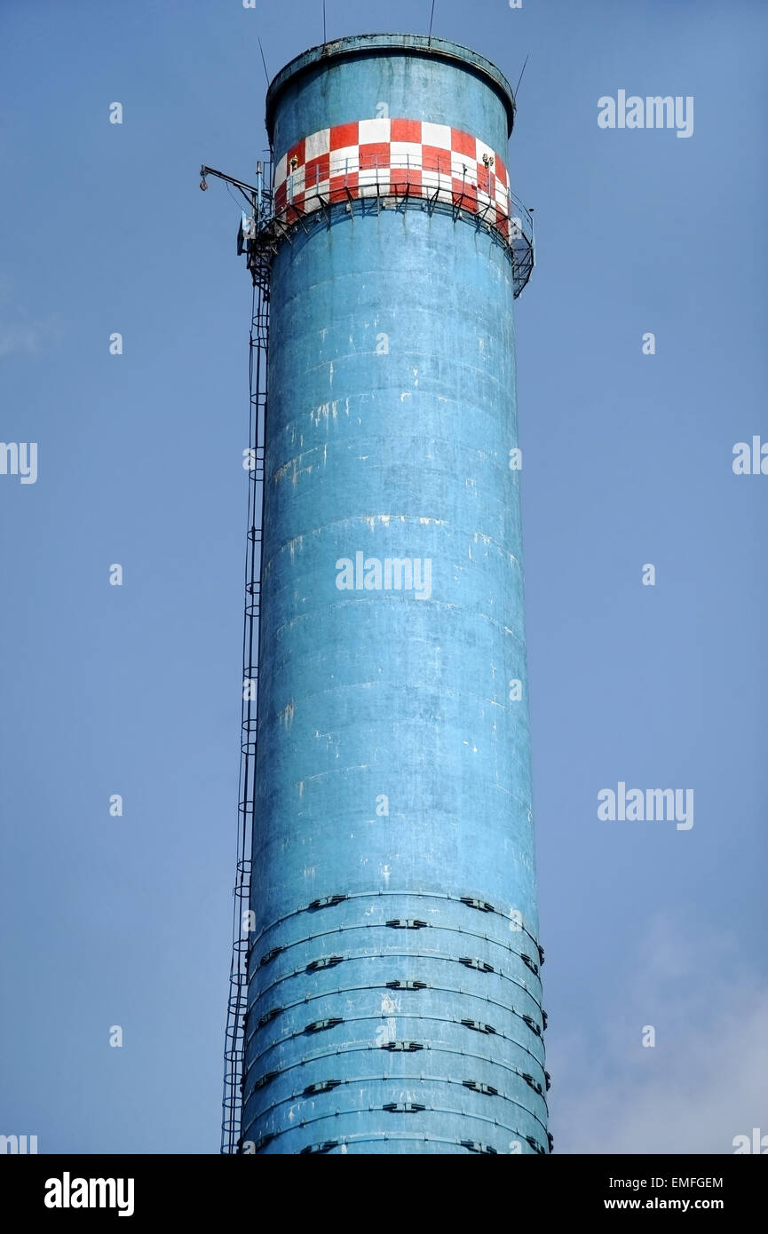 Industrial shot with one blue smoke tower of a thermal power plant Stock Photo