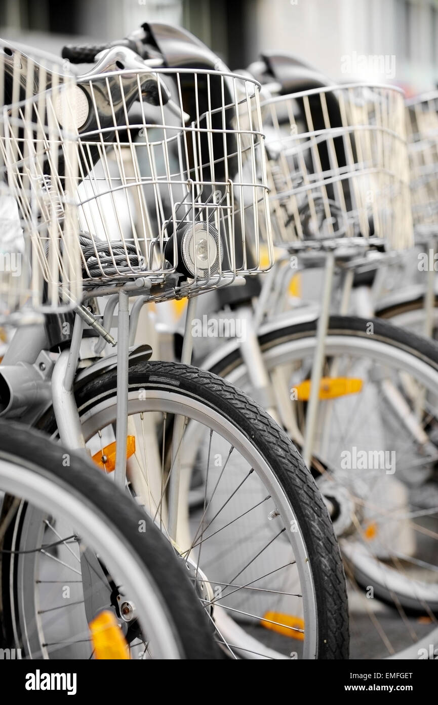City bicycles with front basket are seen in a rental point Stock Photo