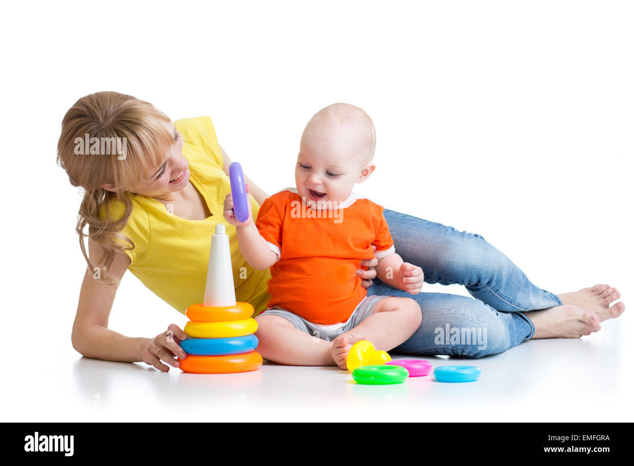 baby boy and mother play together with toy Stock Photo