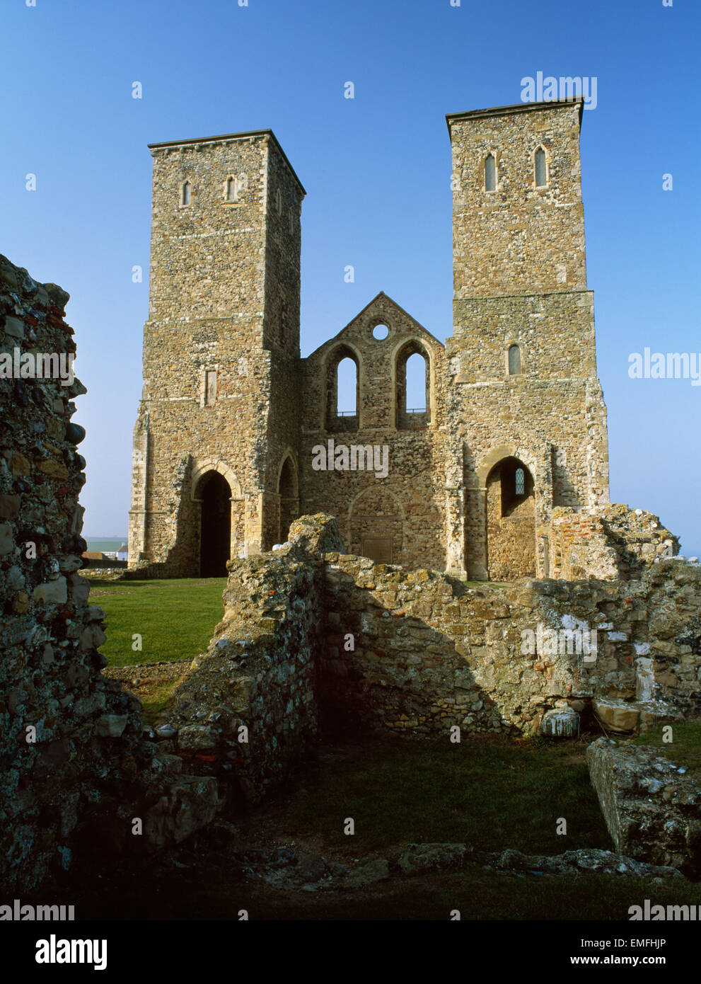 Twin towers from a late 12th century Norman church stand within the Roman fort of Regulbium, Reculver, Kent, England Stock Photo