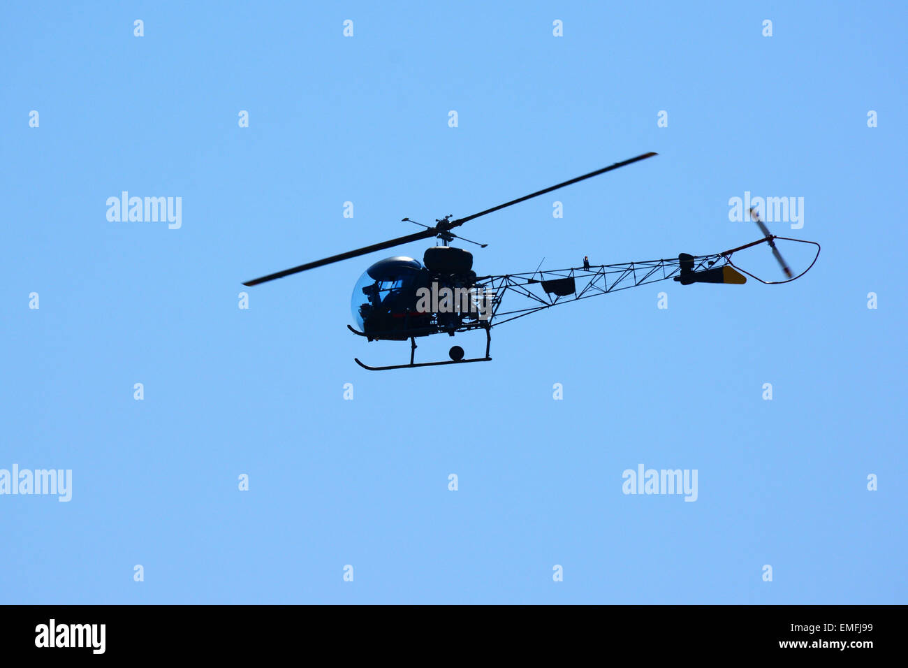 small helicopter in flight Stock Photo