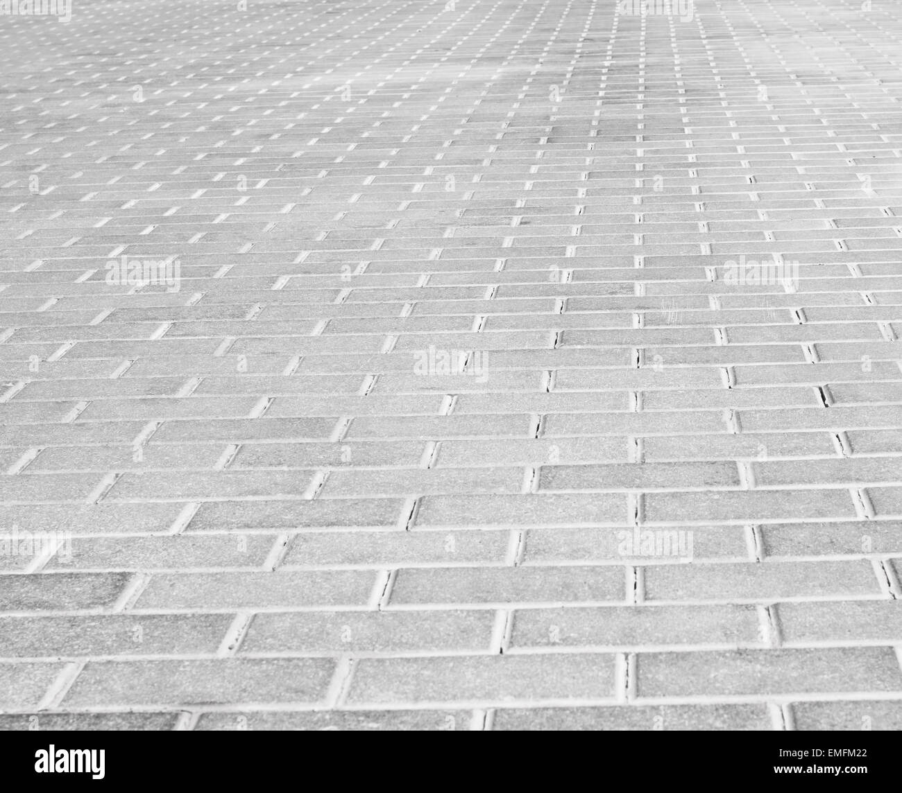 Grey brick stone street road. Light sidewalk, pavement texture Stock Photo