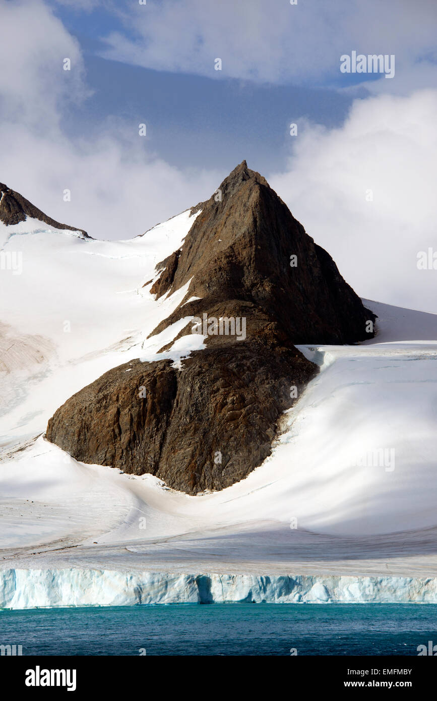 Rock outcrop in middle go glacier Hope Bay Antarctic Peninsular Antarctica Stock Photo