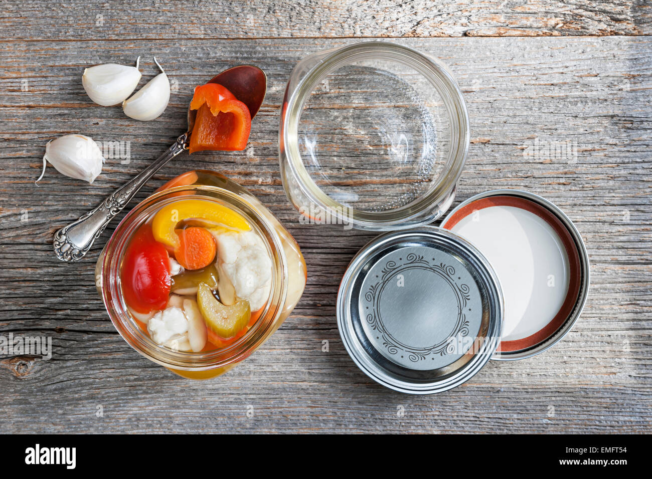 Home preserving mixed vegetables by pickling in glass canning jars Stock Photo Alamy