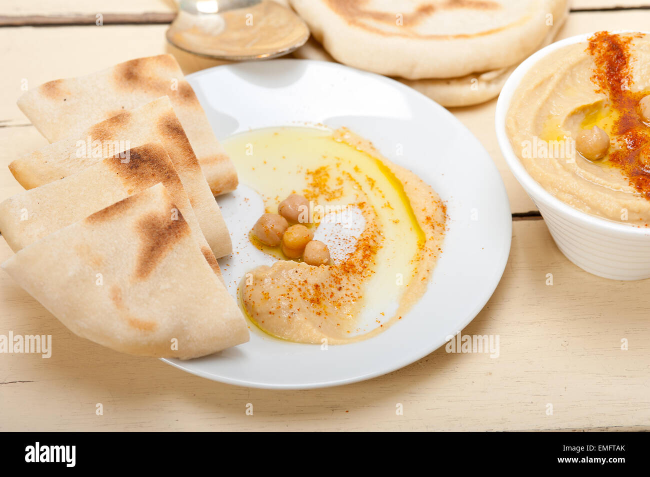traditional chickpeas Hummus with pita bread and paprika on top Stock