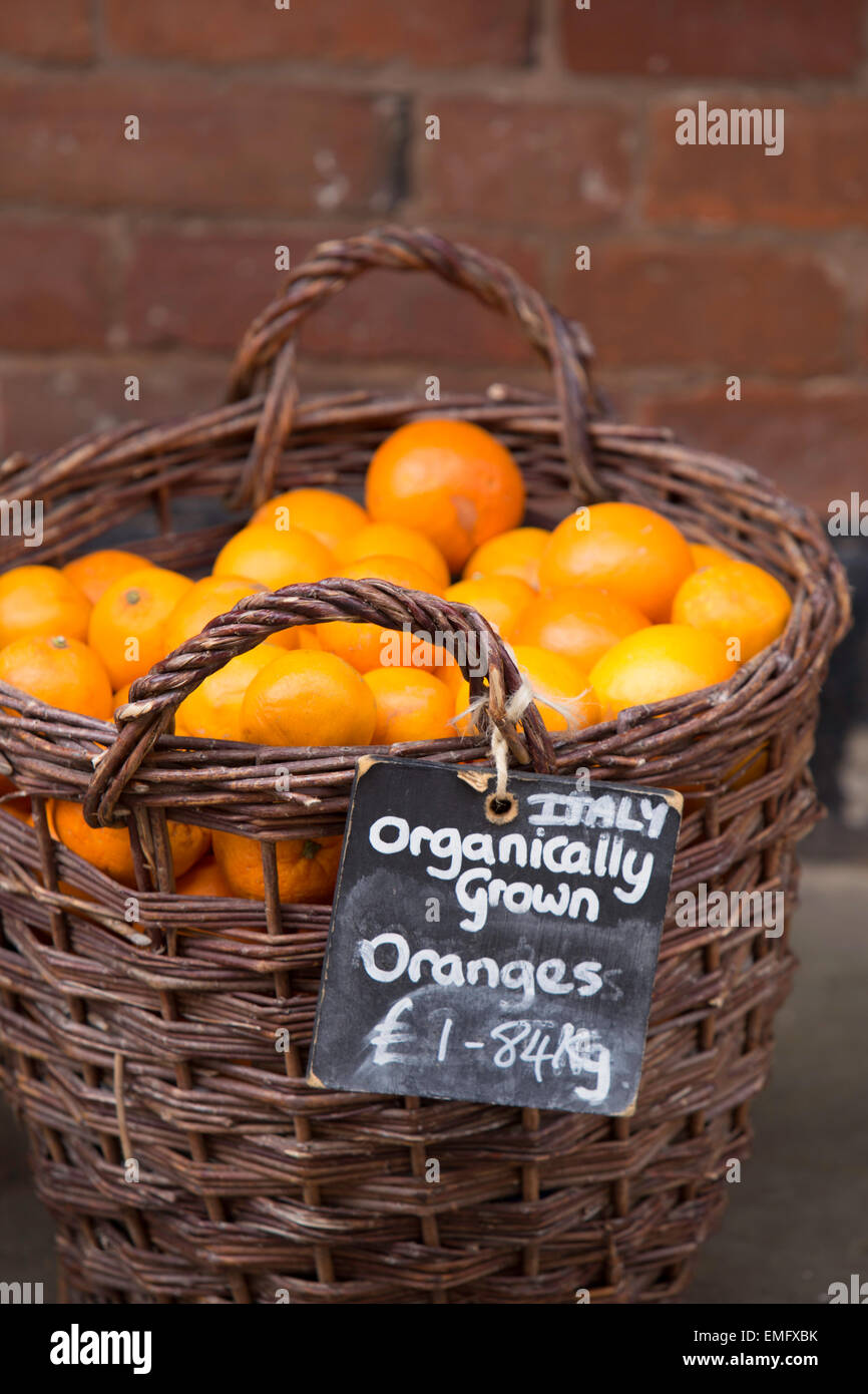 Organic Oranges for sale on a market stall, England, UK Stock Photo