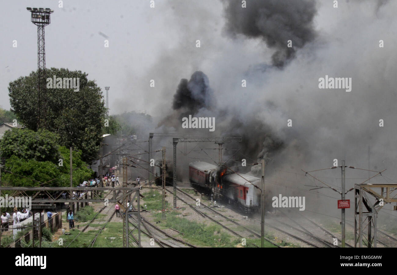 New Delhi, India. 21st Apr, 2015. Two Rajdhani Express trains caught fire today at the New Delhi railway station. The fire was reported in two AC coaches of Bhubaneswar Rajdhani, and a pantry car and three AC coaches of the Sealdah Rajdhani Express. Credit:  Wasim Sarvar/Pacific Press/Alamy Live News Stock Photo