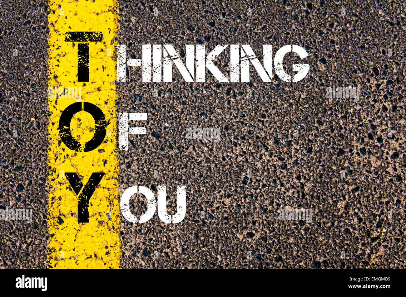 Chat Acronym TOY as Thinking Of You. Yellow paint line on the road against asphalt background