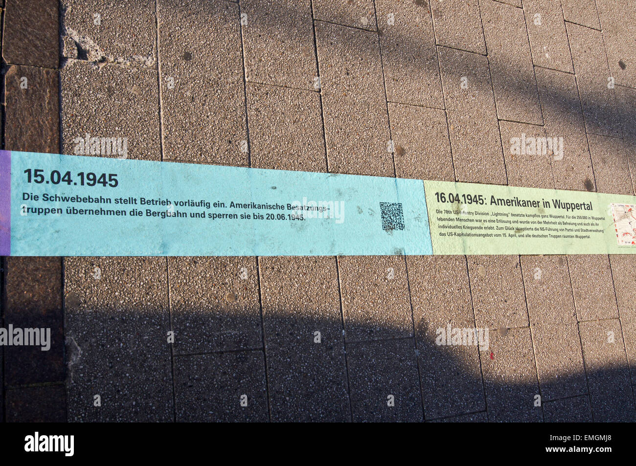 Pavement banner showing timeline of local events of the Second World War, Wuppertal, Nordrhein-Westfalen, Germany Stock Photo
