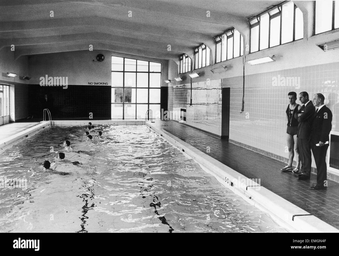 Prince Philip, Duke of Edinburgh, watches 14 borstel boys in the swimming pool with instructor Jim Stuart (left) during the visit to Polmont Young Offenders Institution in Reddingmuirhead, Falkirk, 28th May 1969. Stock Photo