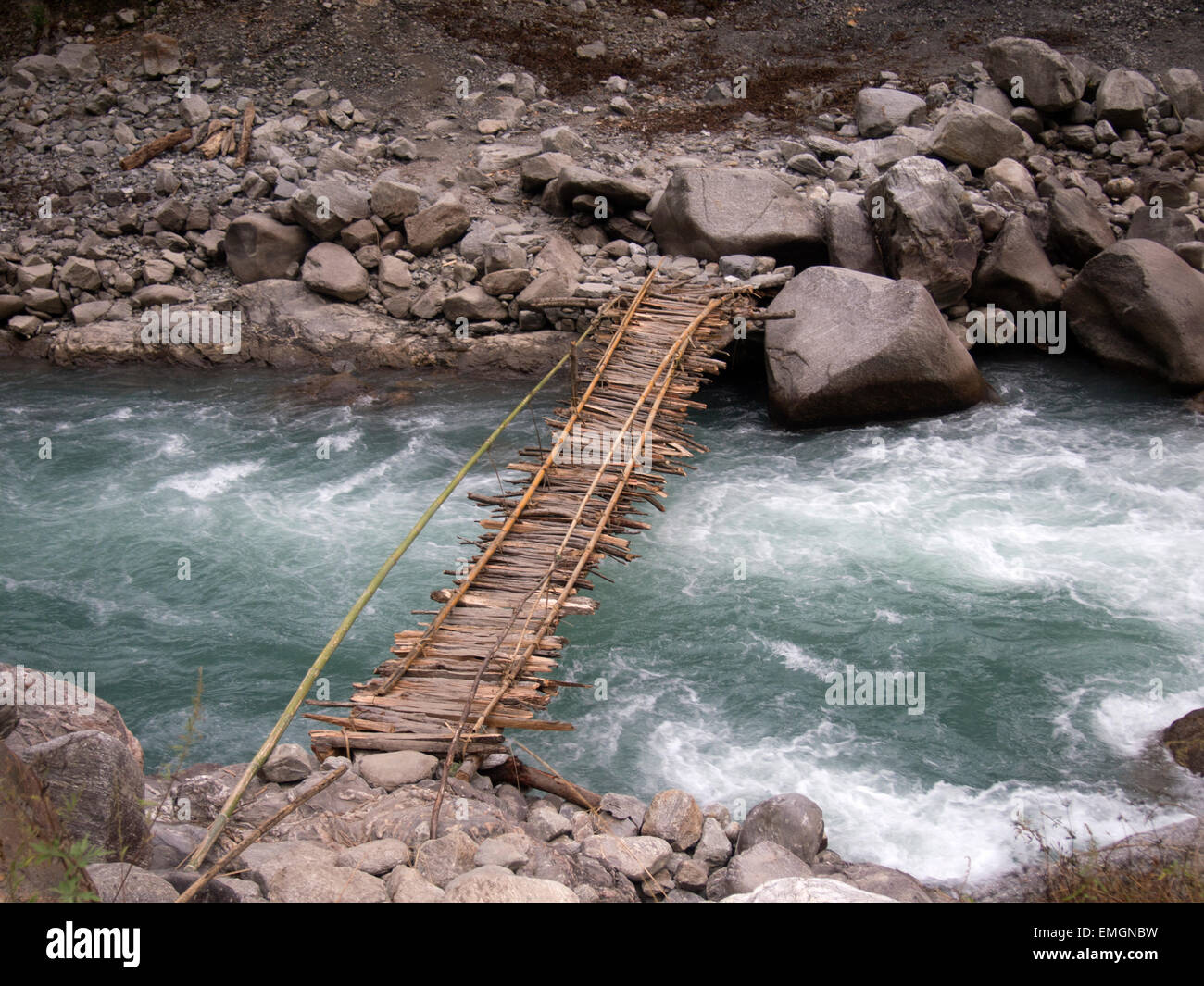 Traditional Wooden Bridge over Mountain Stream Lukla Himalayas Nepal Asia. Rickety Precarious Stock Photo