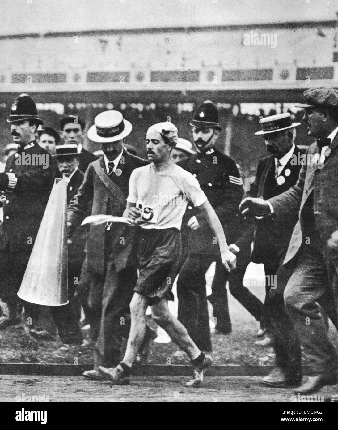 London 1908 Olympic Games One of the earliest Olympic dramas to be captured on film. Pietri Dorando is helped after he collapses just before crossing the finishing line in the 1908 Olympic Marathon. Dorando was disqualified from the race after receiving help from the official holding the megaphone in the final lap. The picture went all around the world. 24 July 1908 Stock Photo