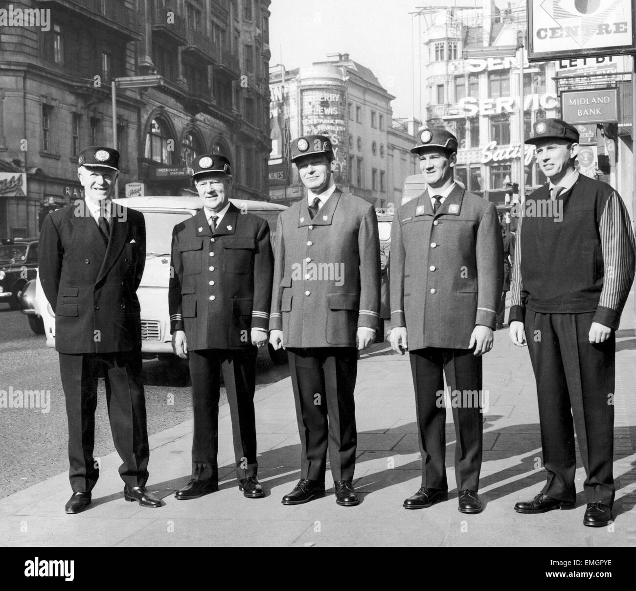 A new look for British Railways. At the Design Centre, Haymarket, London, an exhibition of new designs throughout the railway system ranging from locomotives, right down to the human element. Our Picure Shows: New uniforms for the staff. Left to Right Senior Station Master, Station Master, Inspector, Collector and Porter. 26 February 1963 Stock Photo