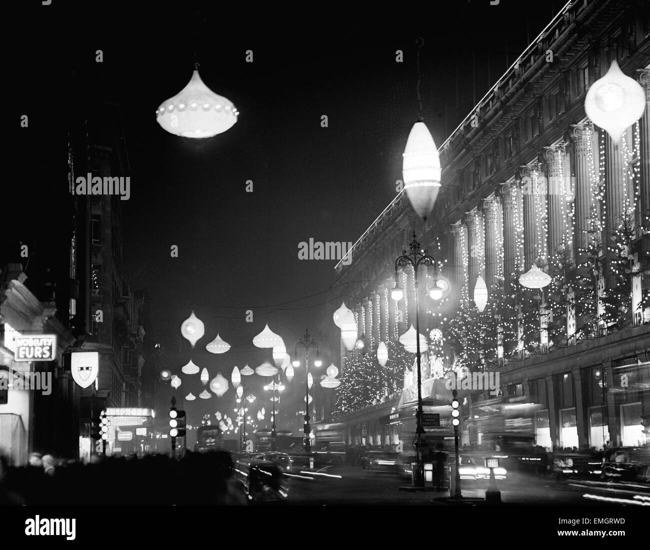 Giant size baubles and beads in the form of illuminated Christmas decorations alight along the length of Oxford Street. 23rd November 1961. Stock Photo