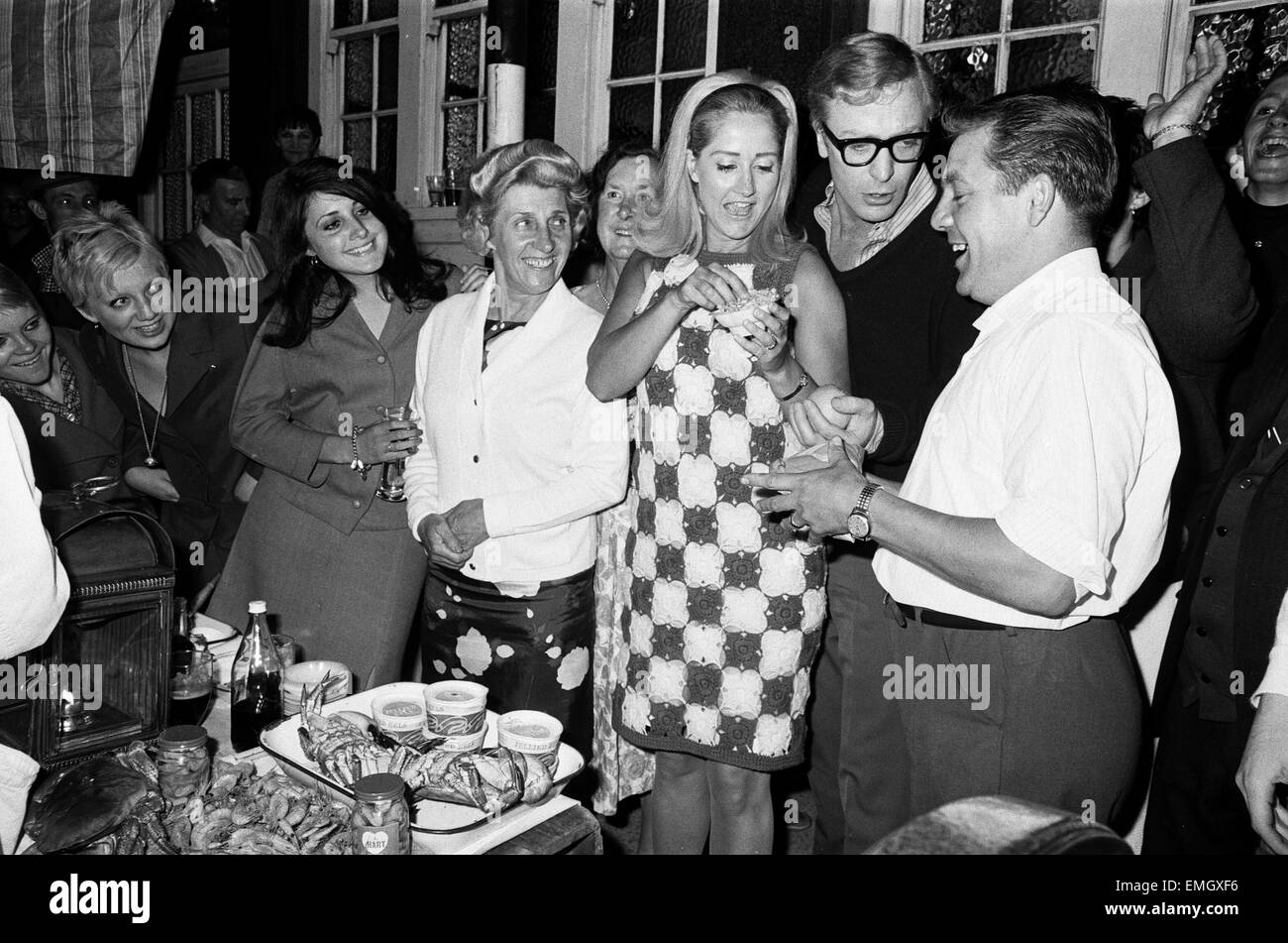 Linda Bird Johnson, daughter of the US President, at a party in a pub on Old Kent Road with Michael Caine and Liz Frazer in attendance. 26th July 1967 Stock Photo