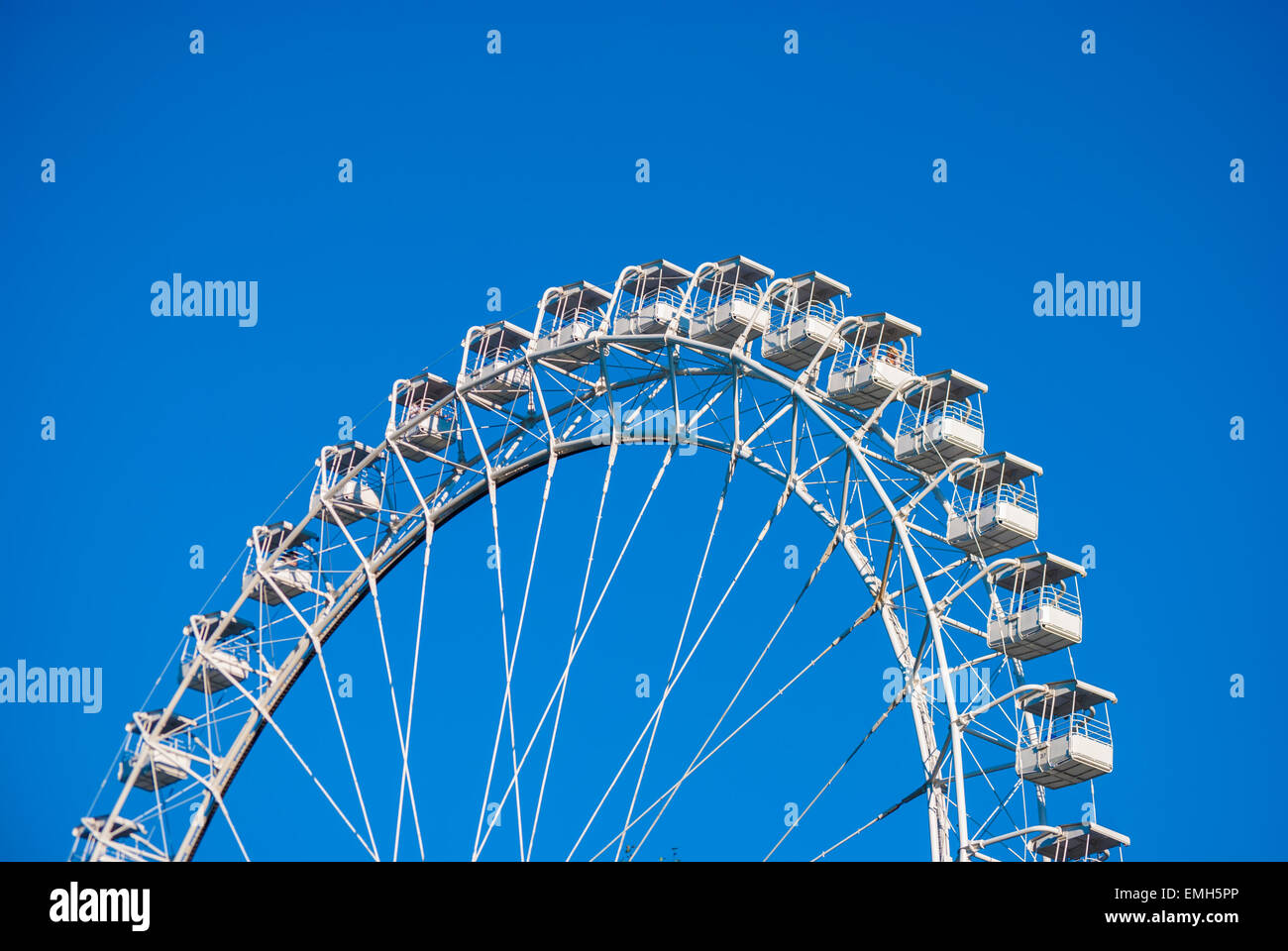 White ferris wheel against blue sky Stock Photo - Alamy
