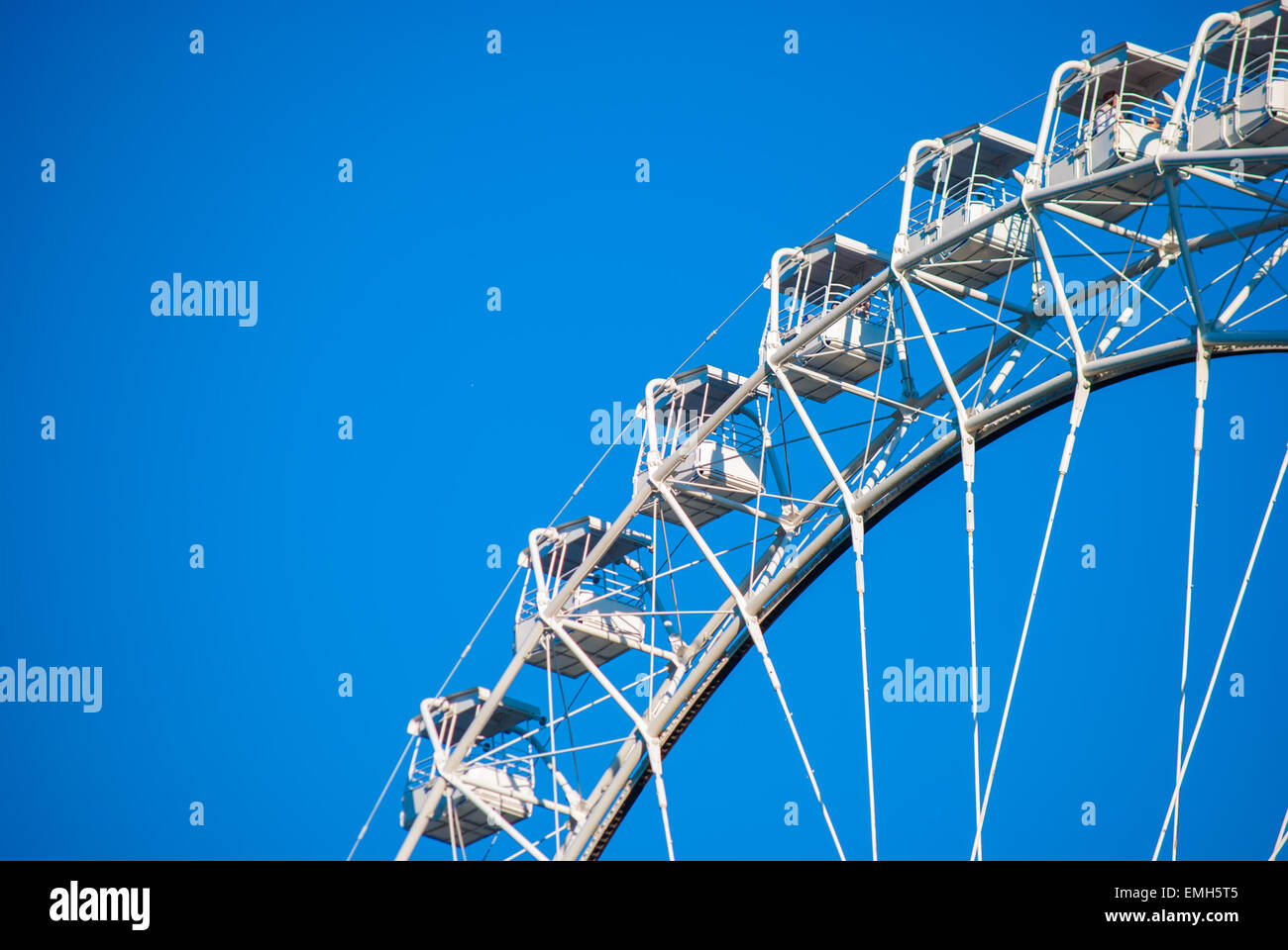 White ferris wheel against blue sky Stock Photo - Alamy