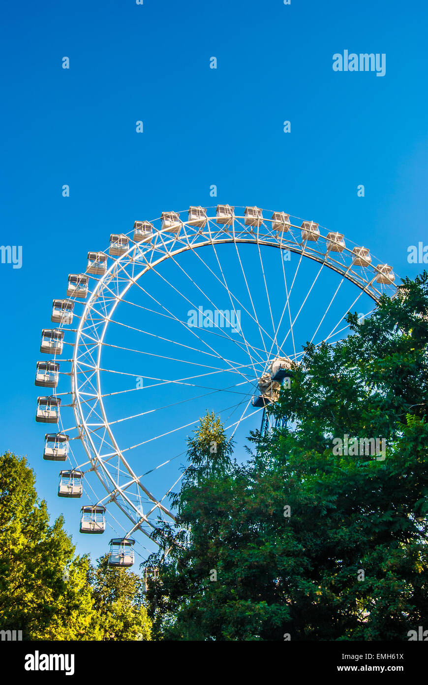White ferris wheel against blue sky Stock Photo - Alamy