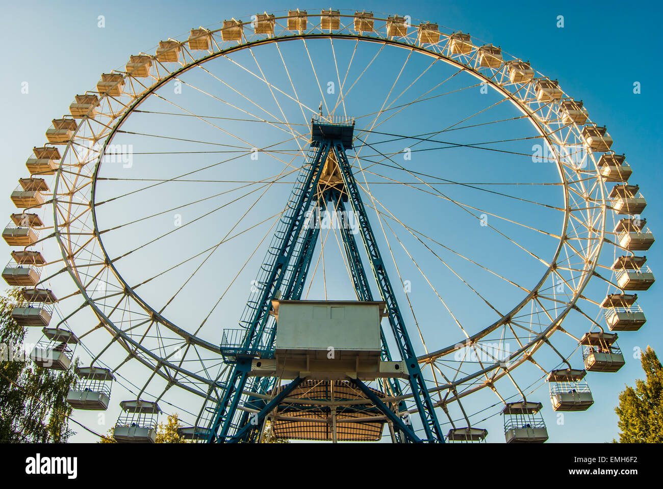 White ferris wheel against blue sky Stock Photo - Alamy