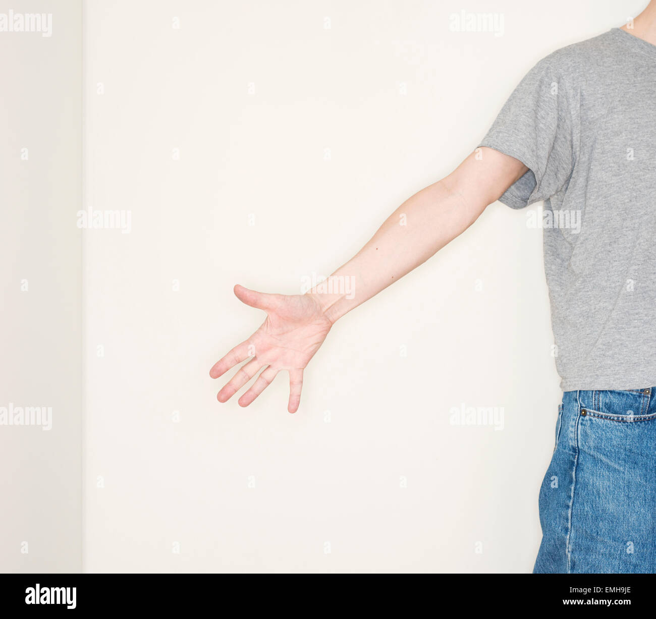 Man reaching out a helping hand. Conceptual image of assistance, being helpful and reaching out. Stock Photo