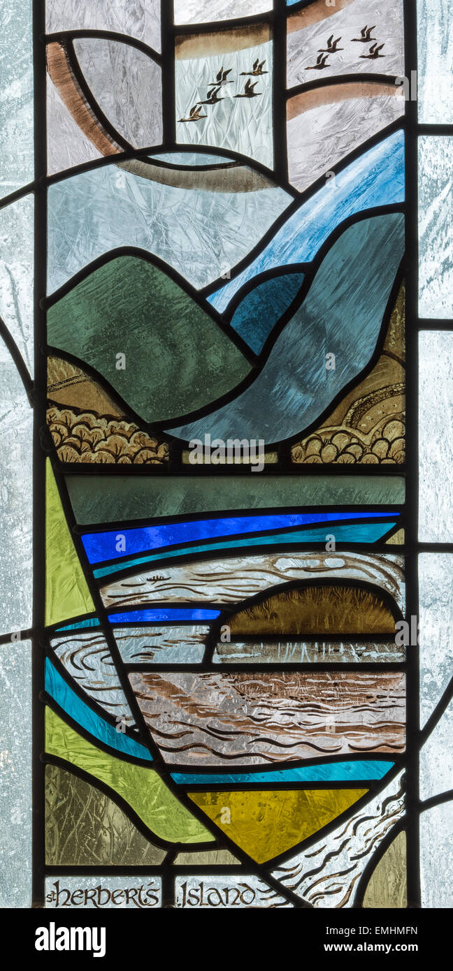 A 20th century stained glass window featuring Herbert's Island, Keswick St. John Church, Cumbria, England, UK Stock Photo