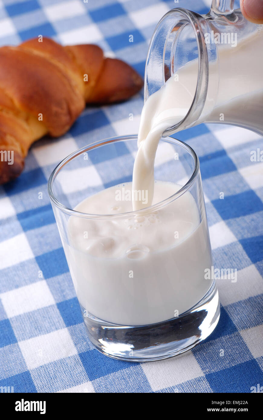 pour the fresh milk in the glass beaker Stock Photo Alamy
