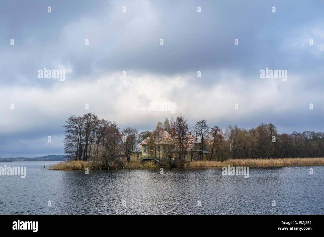 Landscape with wood cabin at an island on lake Galve, Trakai, Lithuania Stock Photo