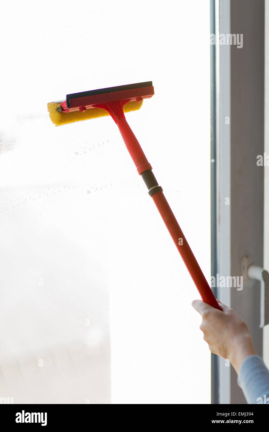 close up of hand cleaning window with sponge Stock Photo Alamy