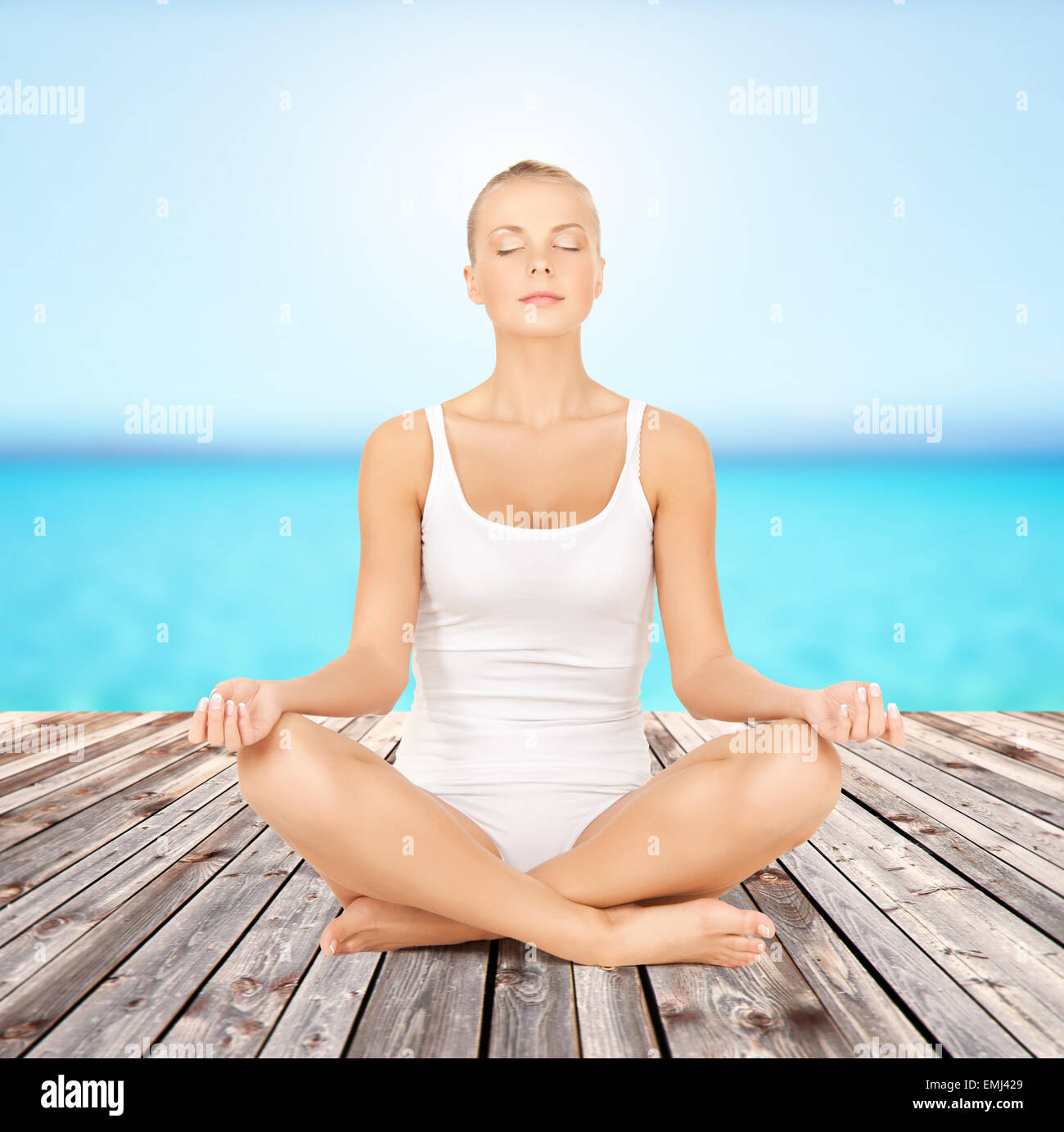 woman meditating in yoga lotus pose Stock Photo - Alamy