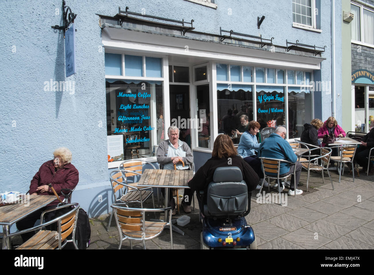 Outside cafe on a sunny day in Machynlleth market town on weekly market