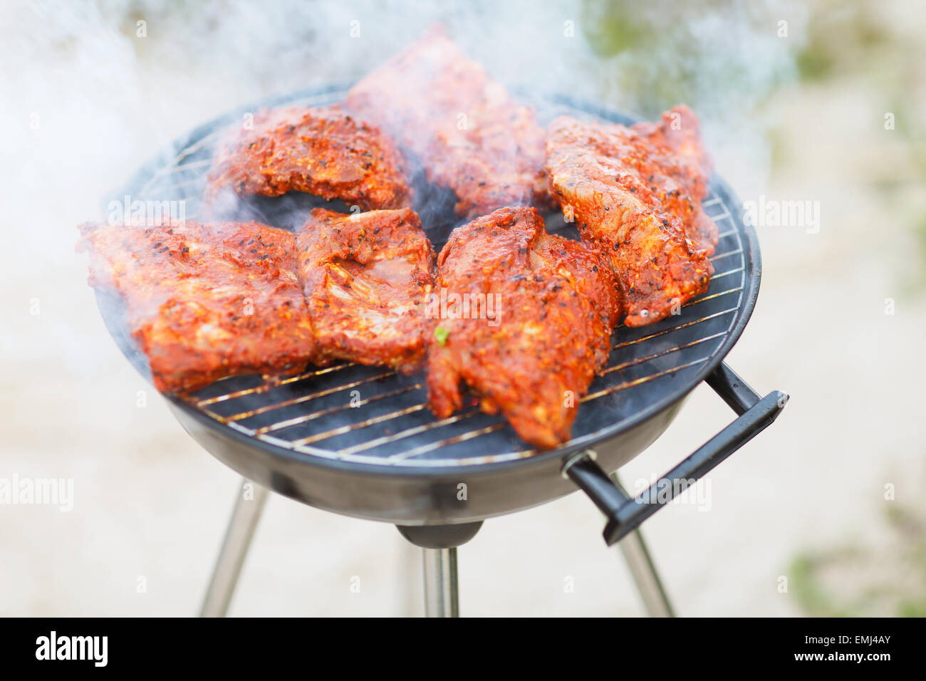 close up of meat on barbecue grill outdoors Stock Photo - Alamy