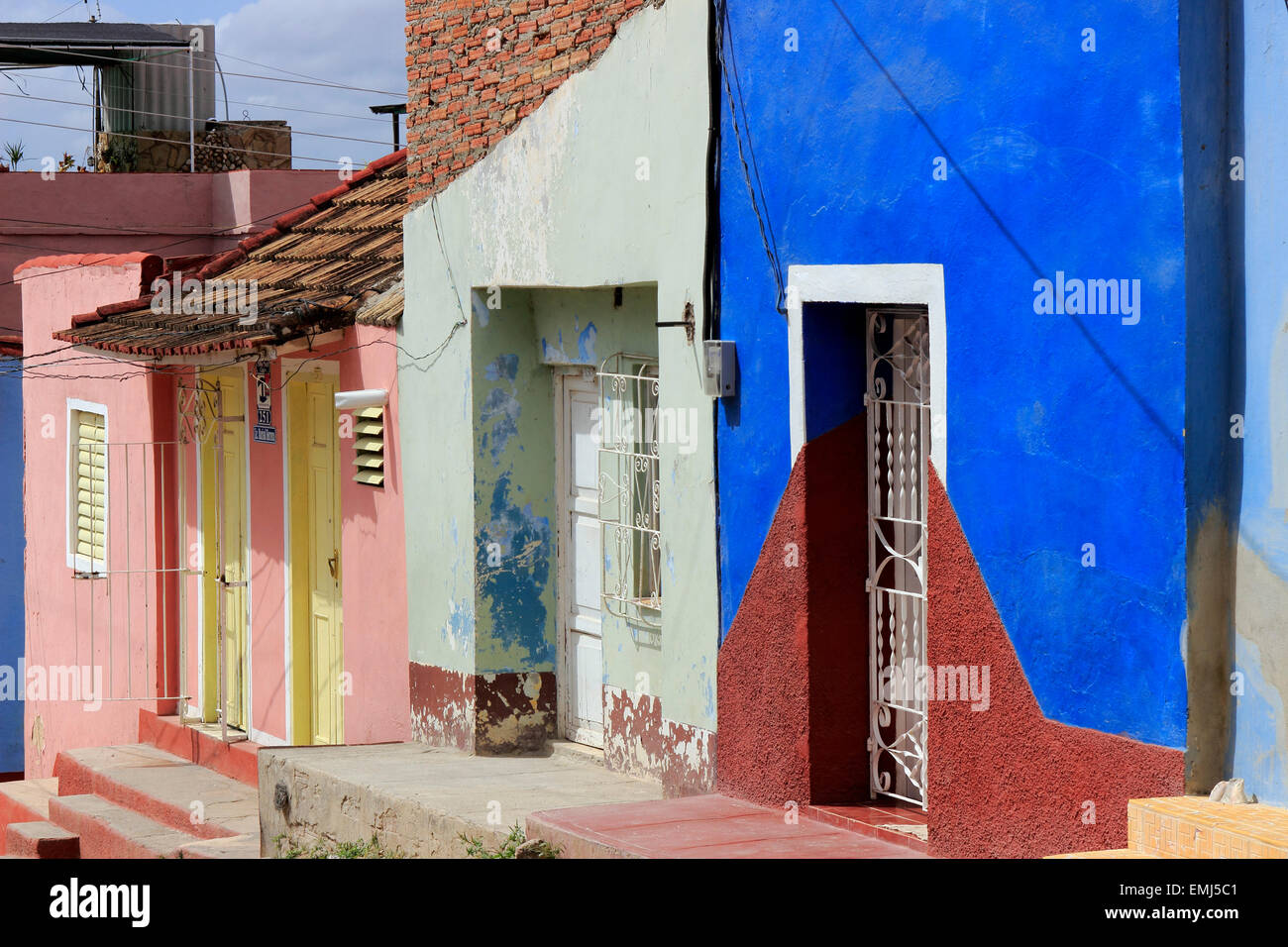 Street scene colorful houses with iron grates Trinidad Cuba Stock Photo