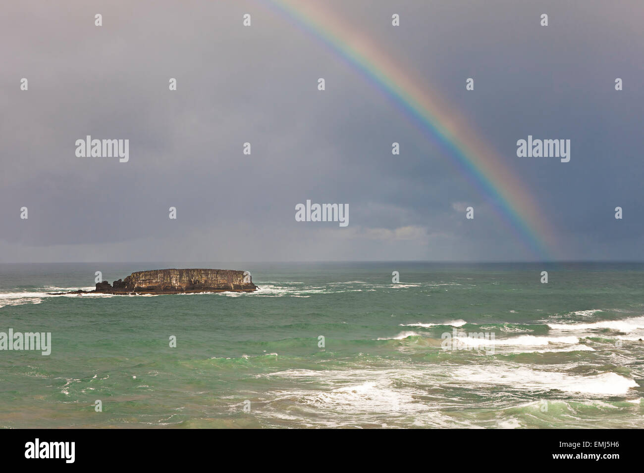 Rainbow over the ocean Stock Photo - Alamy