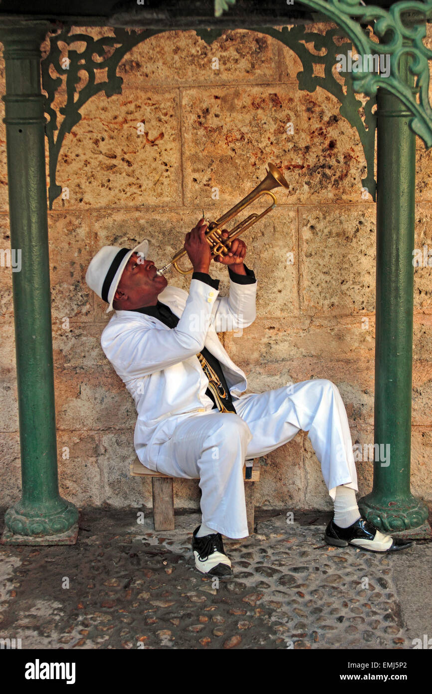 Cuban trumpet player creates music in a small park in Havana Cuba Stock Photo