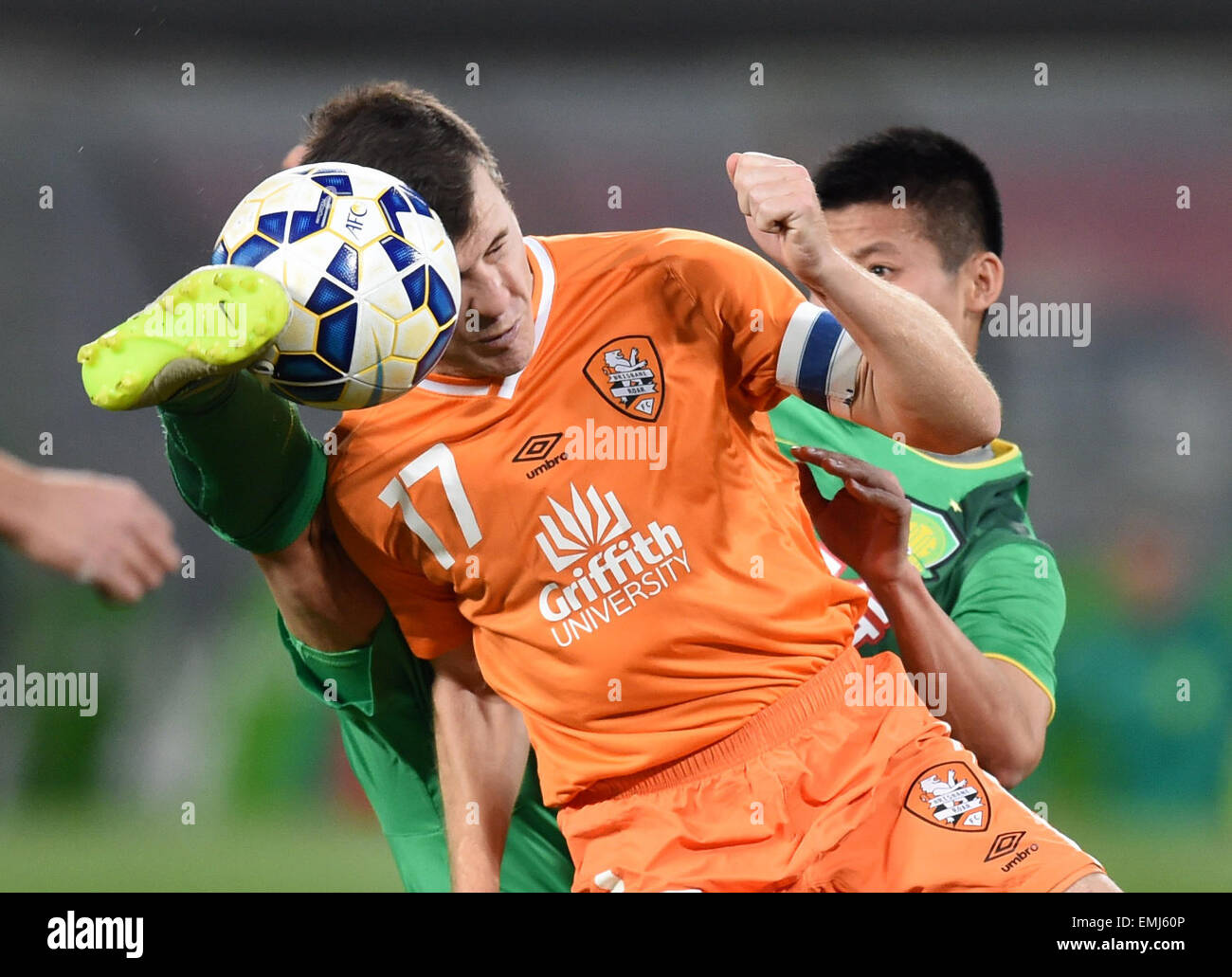 Beijing, China. 21st Apr, 2015. Matt Mckay (front) of Australia's Brisbane Roar vies with Chen Zhizhao of China's Beijing Guoan during a Group G match at the AFC Champions League 2015 in Beijing, capital of China, April 21, 2015. Brisbane Roar won 1-0. © Guo Yong/Xinhua/Alamy Live News Stock Photo