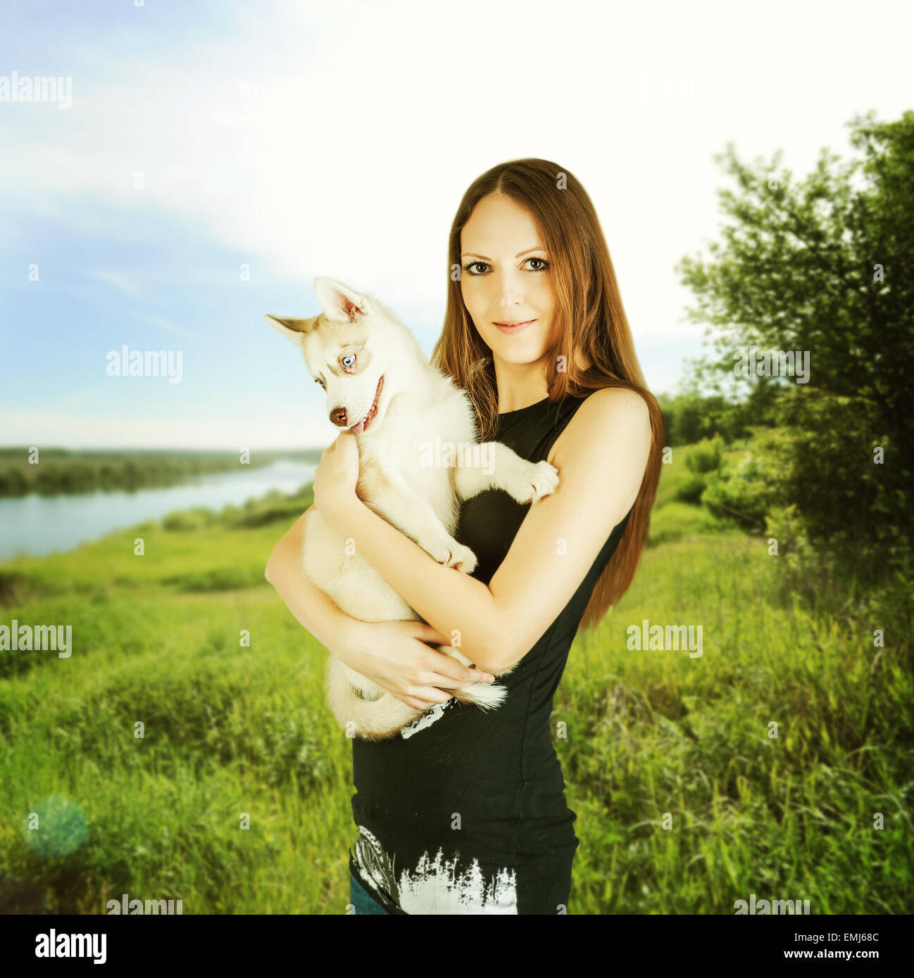 Siberian Husky. young happy woman outdoor holding Siberian Husky dog ...