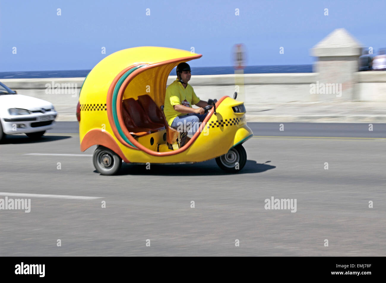 Coco Taxi a common means of transportation along the Malecon in Havana Cuba Stock Photo