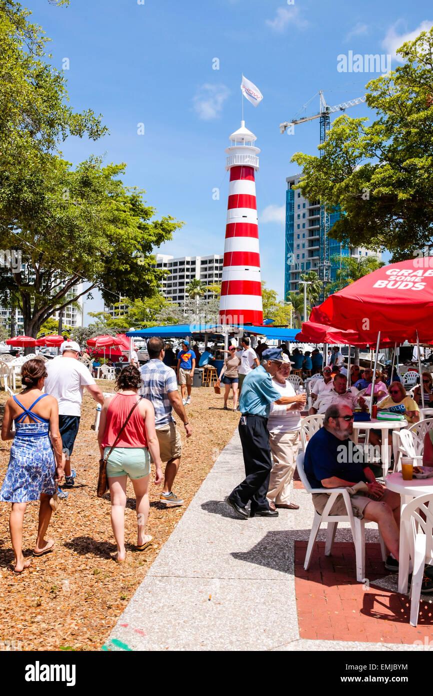 Red and white lighthouse on display with refreshments and seating at the Suncoast boat show at the downtown waterfront Marina Ja Stock Photo