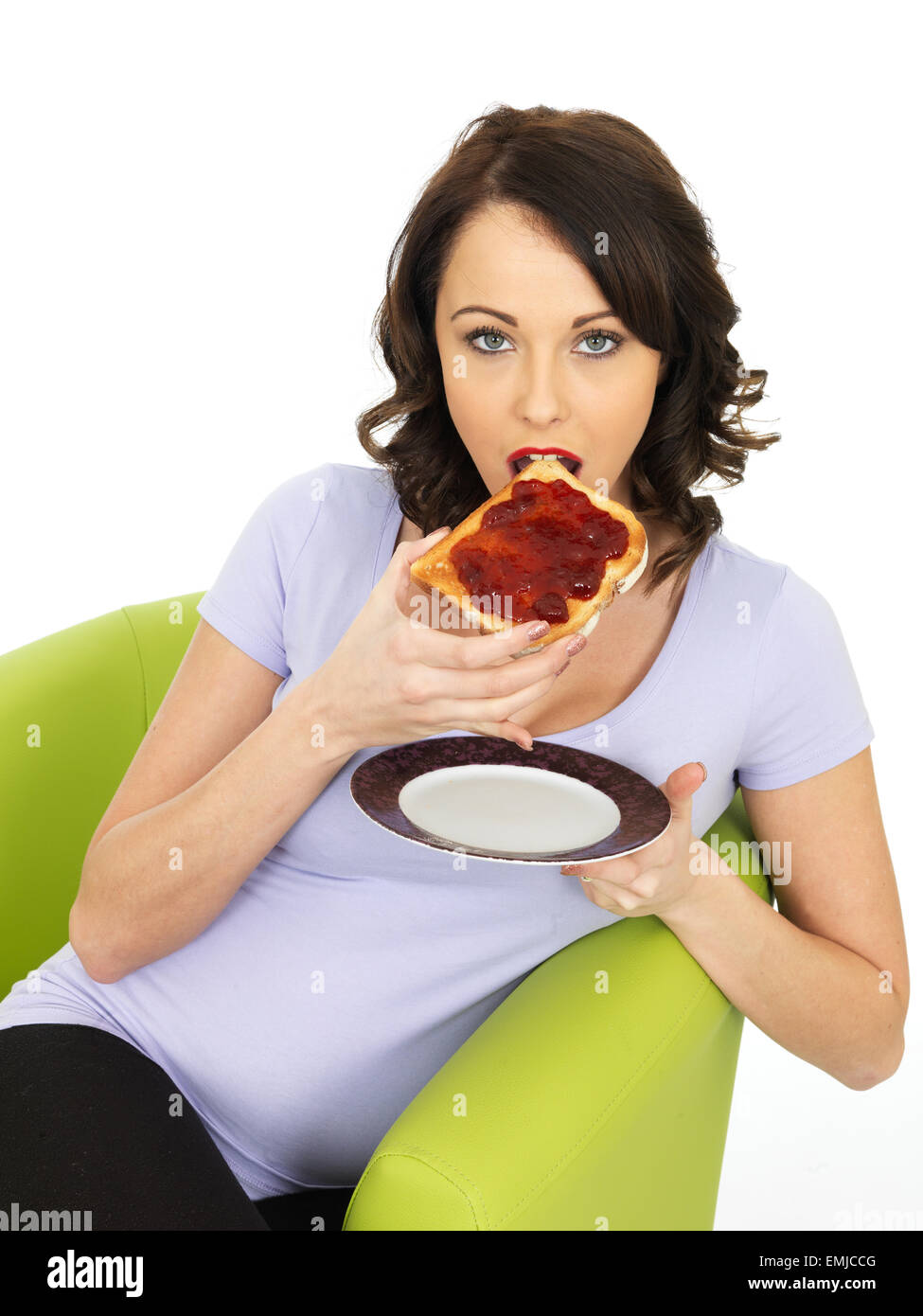 Healthy Young Woman With Strawberry Jam on Toast Stock Photo