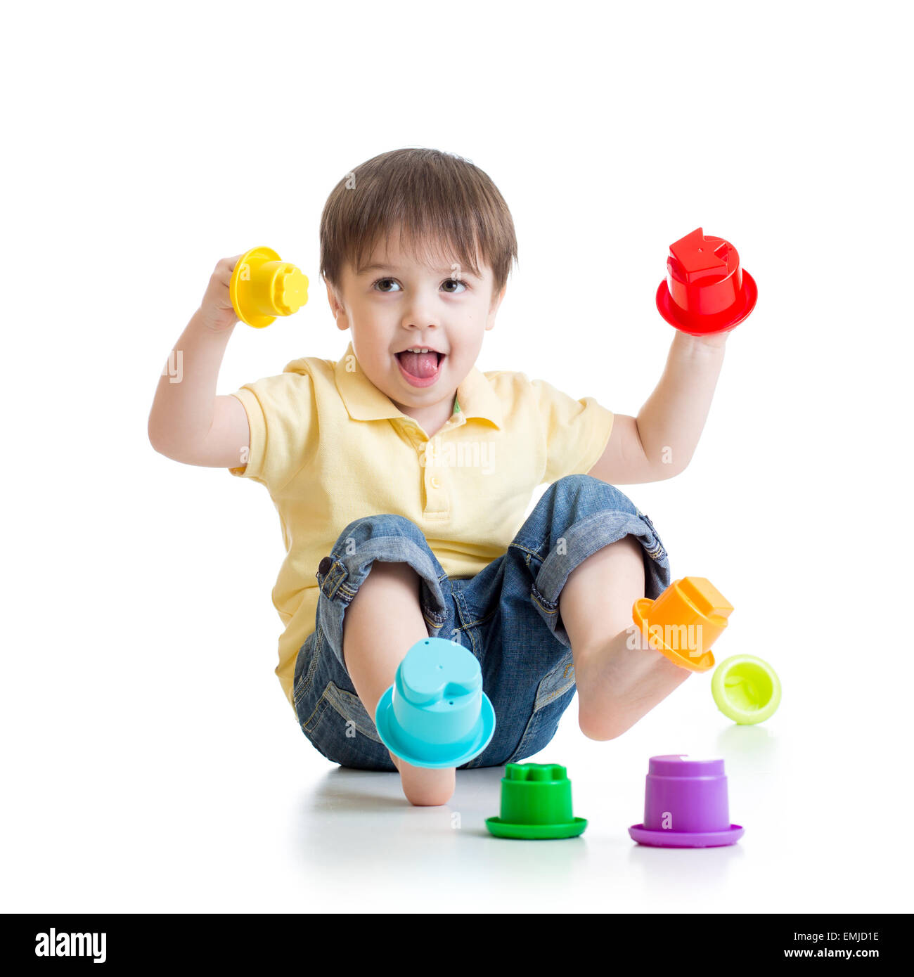 little boy playing with color toys Stock Photo - Alamy