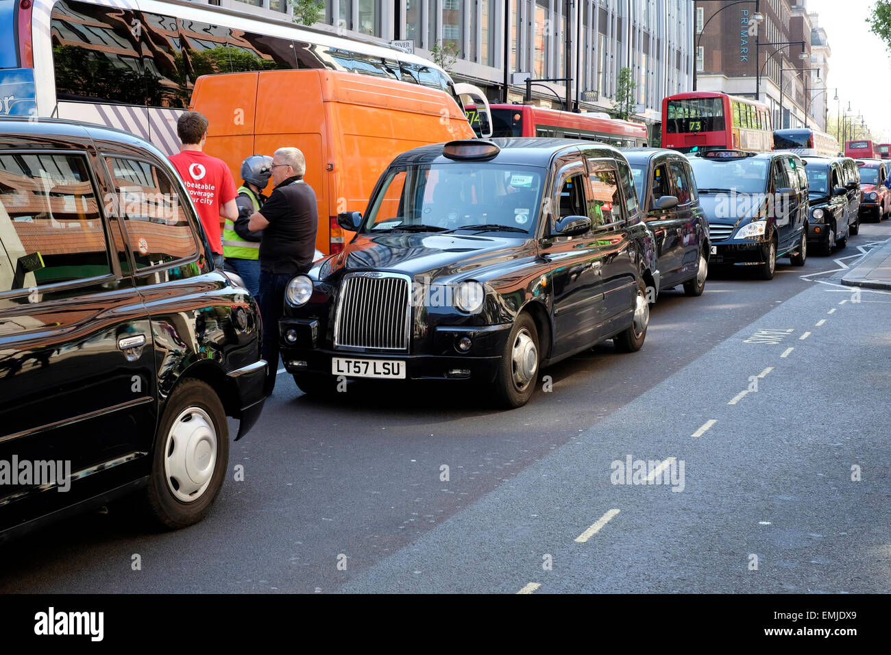 Oxford Street blocked by  taxi drivers as they protest against illegal mini cabs. Stock Photo