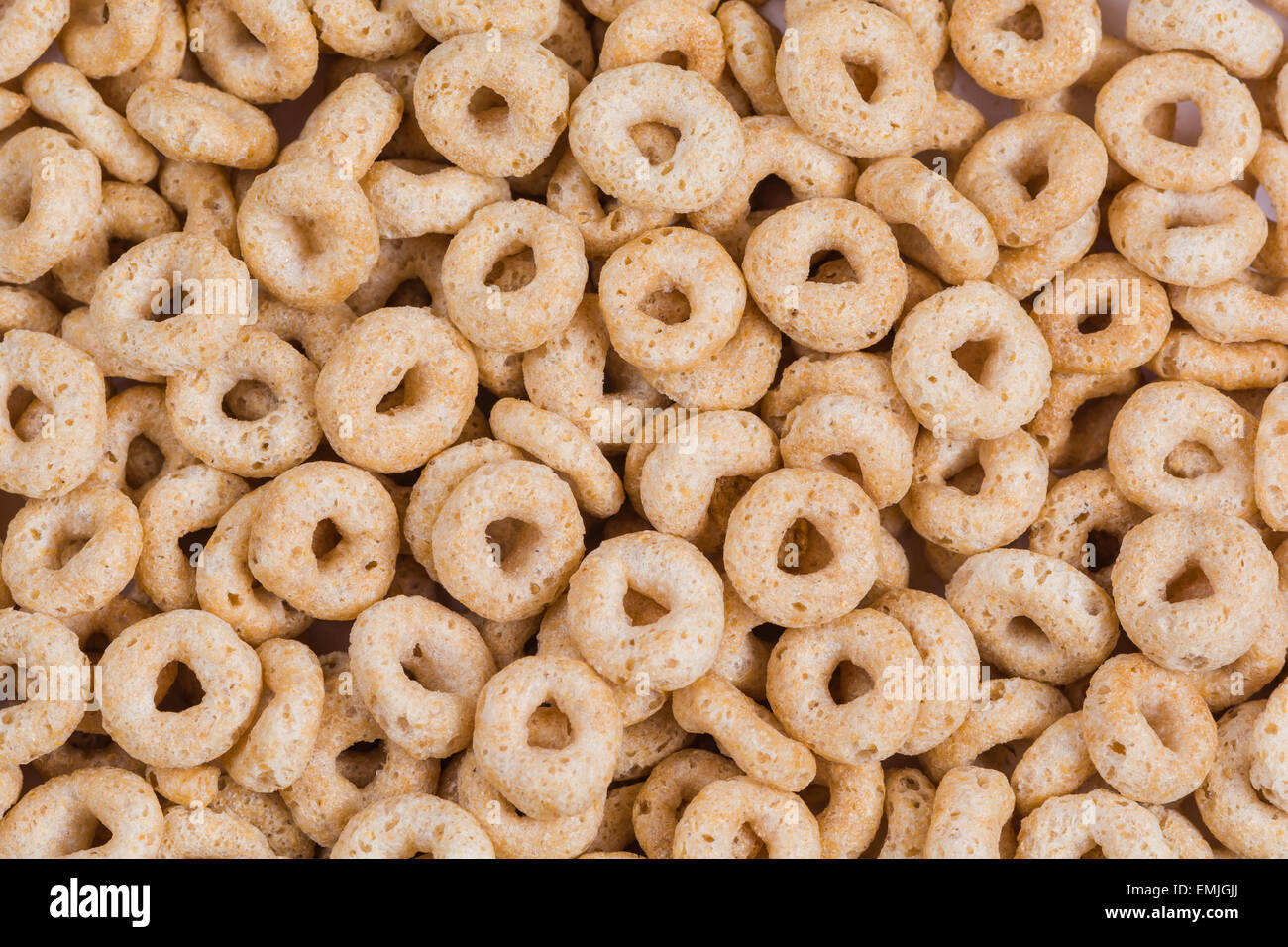 Whole grain O shaped cereal background image.  Abstract style of background using whole grain neutral color cereal Stock Photo