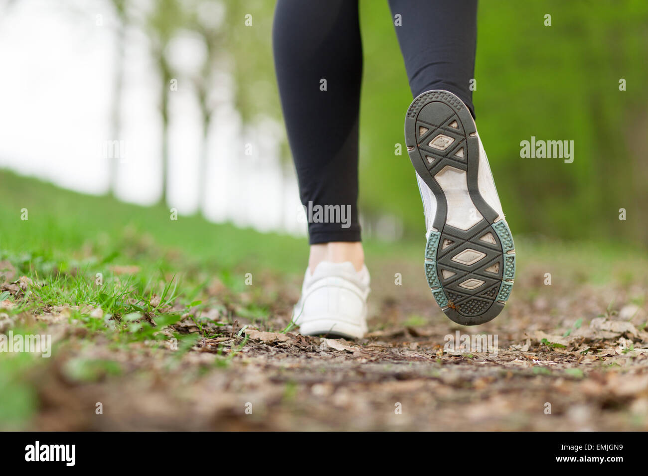 Feet of a running woman Stock Photo Alamy