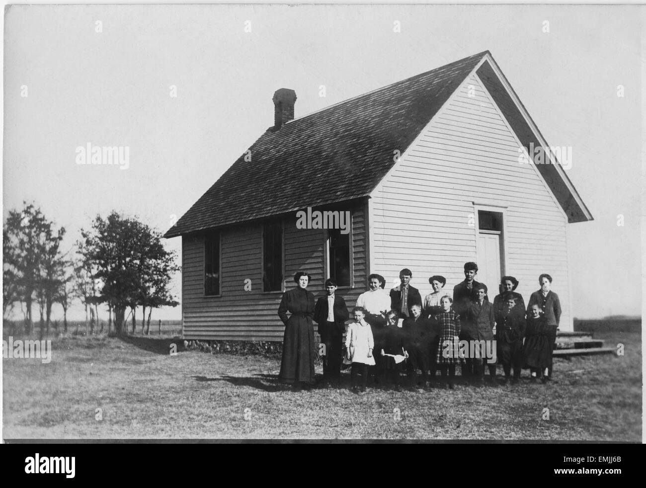 Teacher and Students in Front of One-Room School House, Portrait, USA, circa 1900 Stock Photo