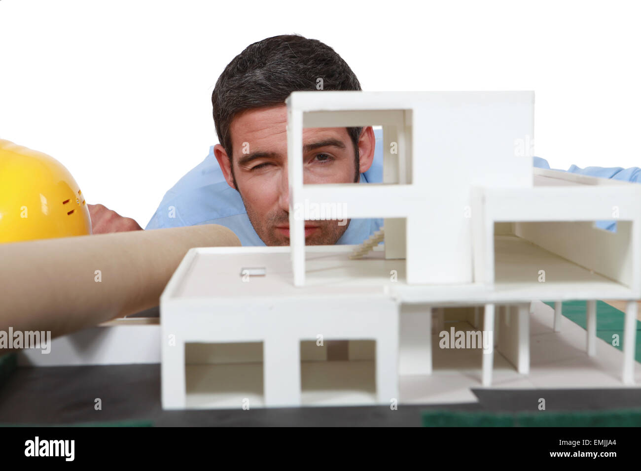 Architect analyzing scale model of building Stock Photo Alamy