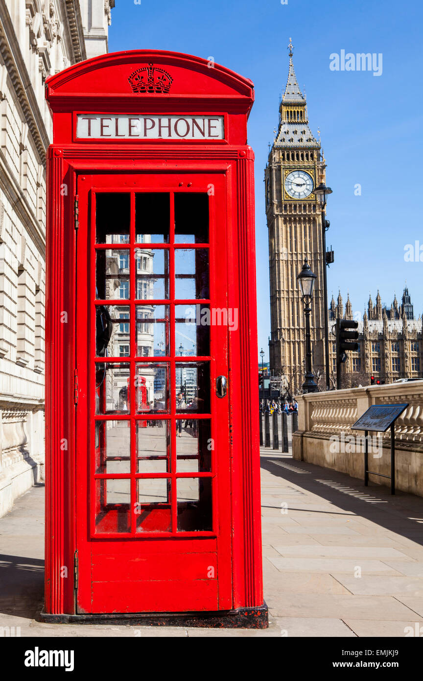 An iconic red Telephone Box with Big Ben in the background in London. Stock Photo