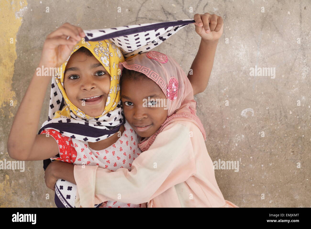 Two young girls in saris, Stone town, Zanzibar Stock Photo